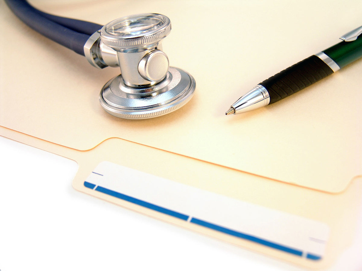 Free Medical Tools on Folder Background Stock Photography