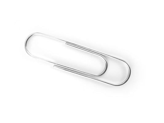 Free Single Silver Paperclip on White Background Stock Photography