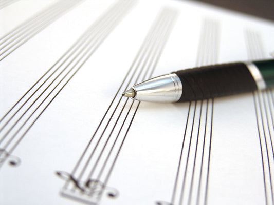 Free Pen on Sheet Music Paper Stock Photography