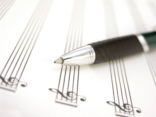 Free Pen Laying Across Sheet Music Page Stock Photography
