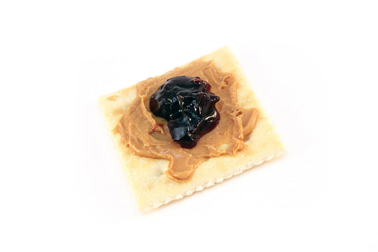 Free Peanut Butter and Jelly on Saltine Cracker Stock Photography
