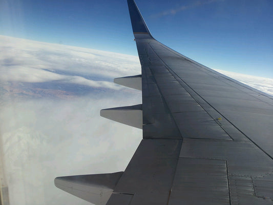 Free Airplane Wing Above Clouds Stock Photography