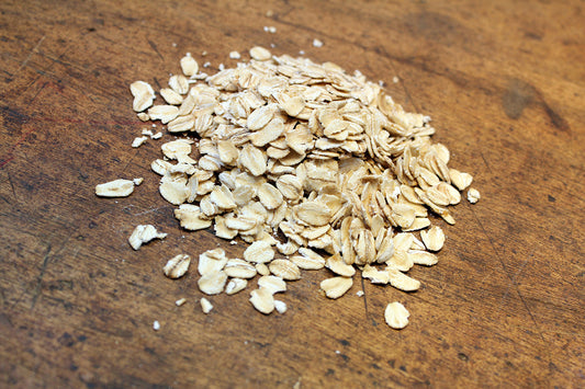 Free Pile of Rolled Oats on Wooden Table Stock Photography