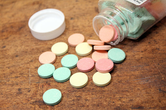 Free Colorful Antacid Tablets on Table Stock Photography