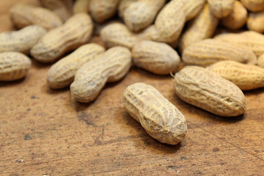 Free Peanuts in Shell on Wooden Table Stock Photography