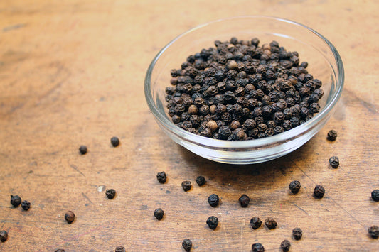 Free Black Peppercorns in Glass Bowl Stock Photography