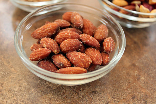 Free Seasoned Almonds in Glass Bowl Stock Photography