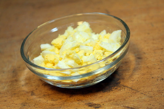 Free Chopped Boiled Eggs in Glass Bowl Stock Photography