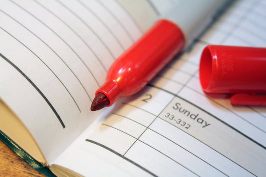 Free Red Marker on Planner Page Stock Photography