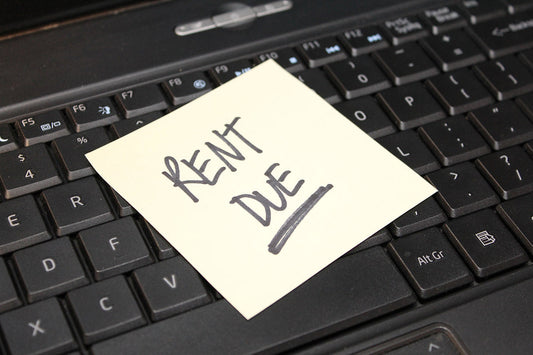 Free Rent Due Sticky Note on Keyboard Stock Photography